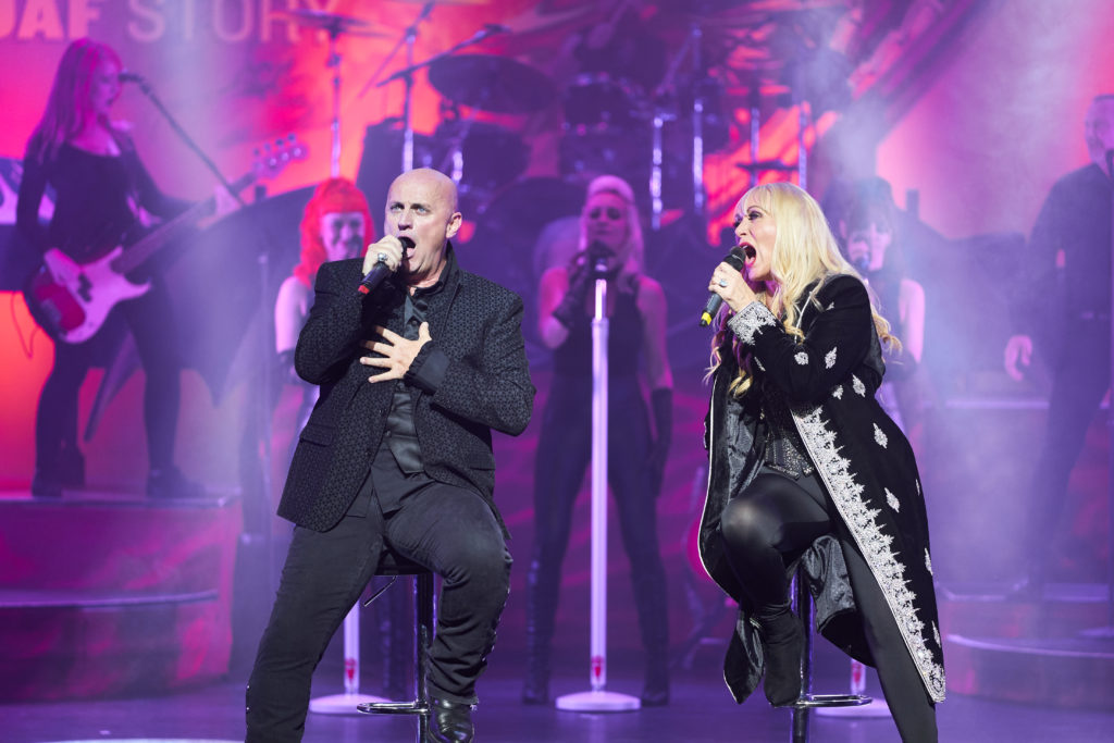 Steve Steinman and Lorraine Crosby performing together on stage for The Meat Loaf Story